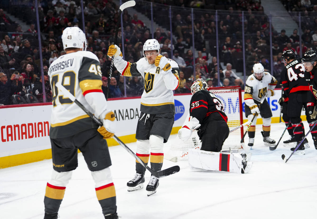 Vegas Golden Knights center Jack Eichel (9) celebrates with teammate Ivan Barbashev (49) after ...