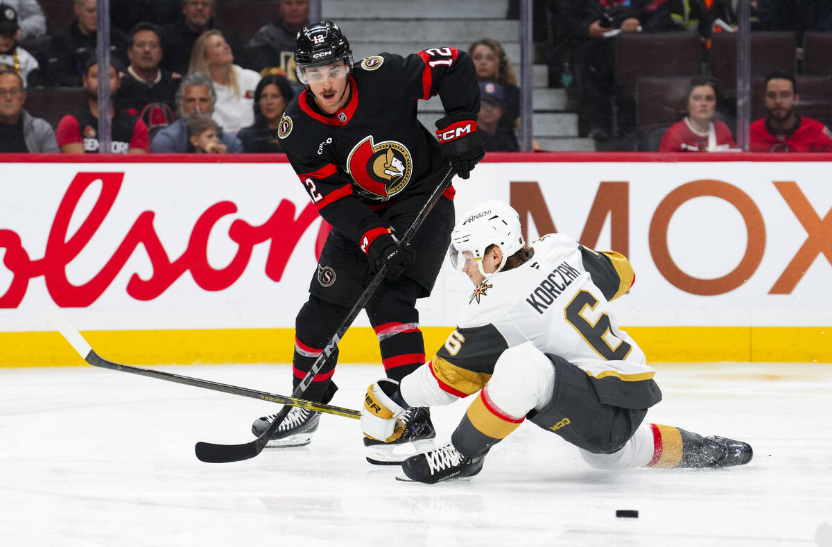 Vegas Golden Knights defenseman Kaedan Korczak (6) tries to stop Ottawa Senators center Shane P ...