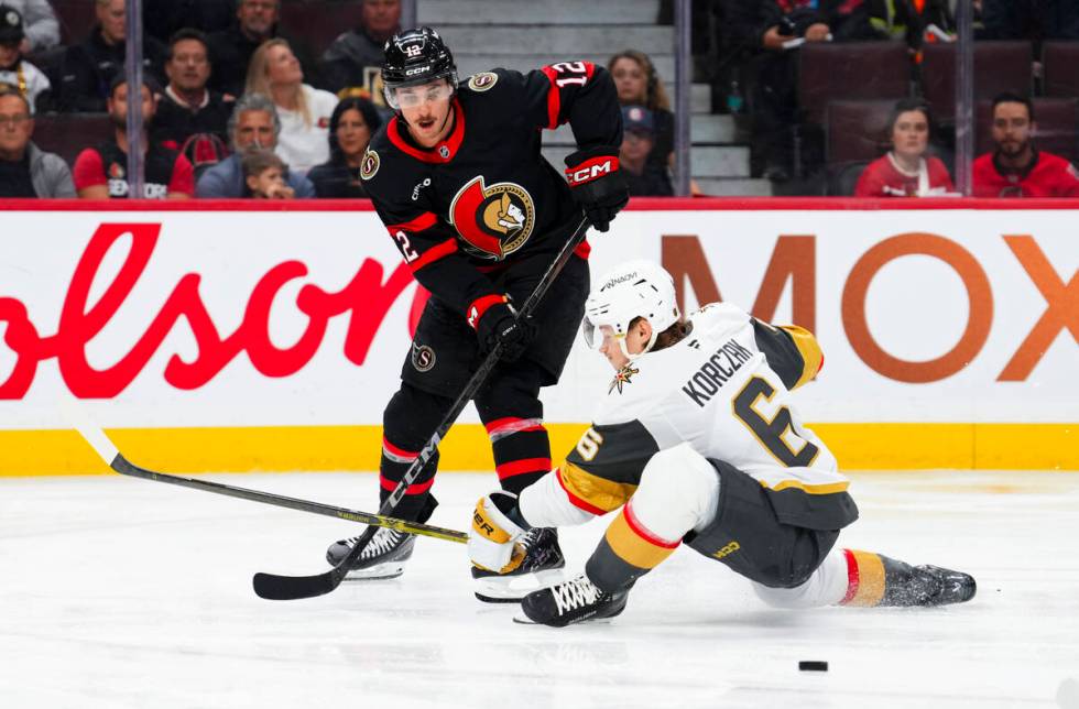 Vegas Golden Knights defenseman Kaedan Korczak (6) tries to stop Ottawa Senators center Shane P ...