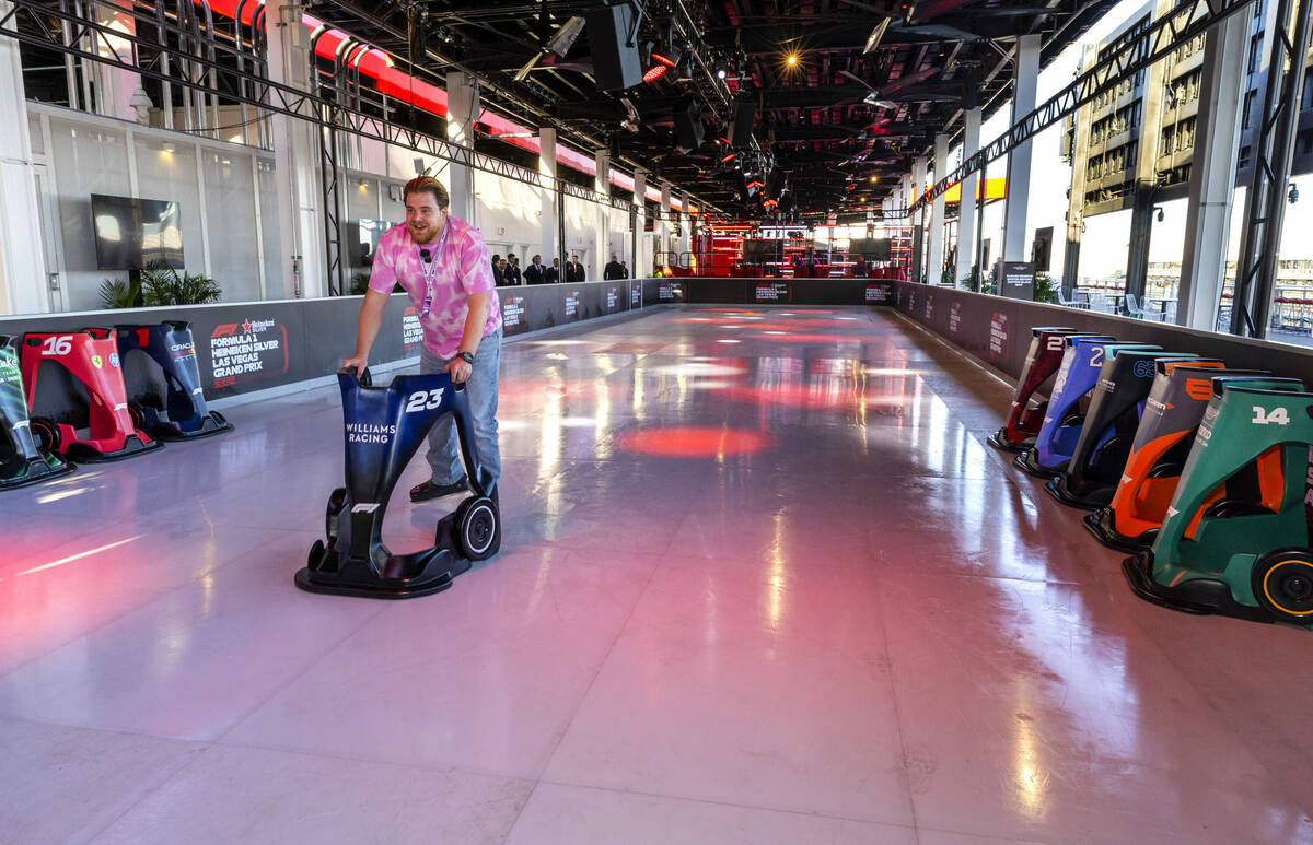 Kevin Scheuren from Germany tests out the synthetic ice rink during a tour atop the Formula One ...