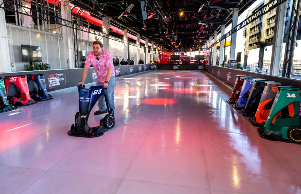 Kevin Scheuren from Germany tests out the synthetic ice rink during a tour atop the Formula One ...