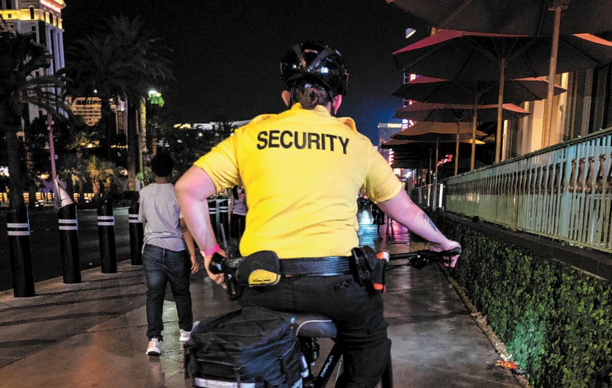 A security guard bikes near the Paris Hotel and Casino on the Las Vegas Strip, early Thursday, ...