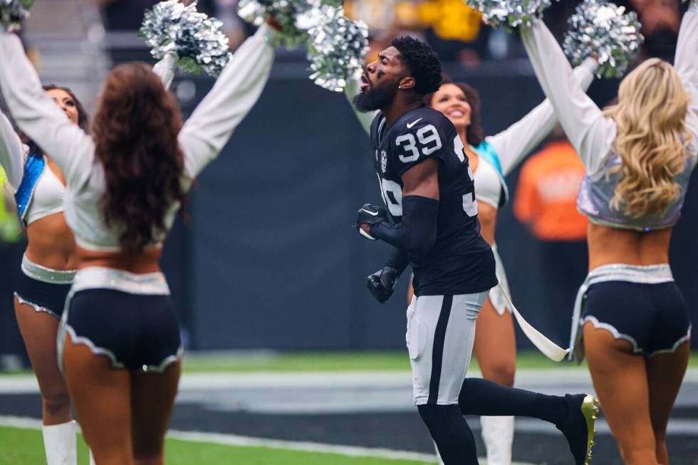 Raiders cornerback Nate Hobbs (39) gets pumped up during player introductions before an NFL foo ...