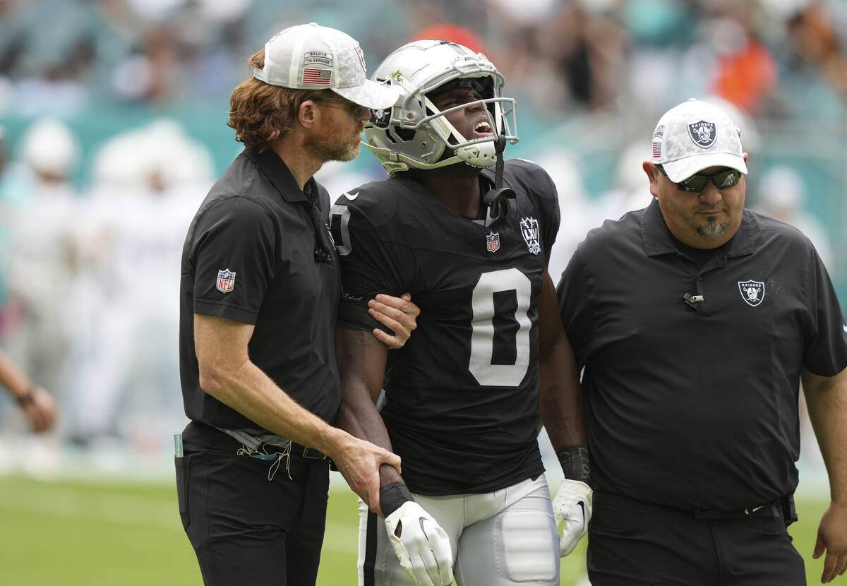 Las Vegas Raiders cornerback Jakorian Bennett (0) is led off the field during the first half of ...