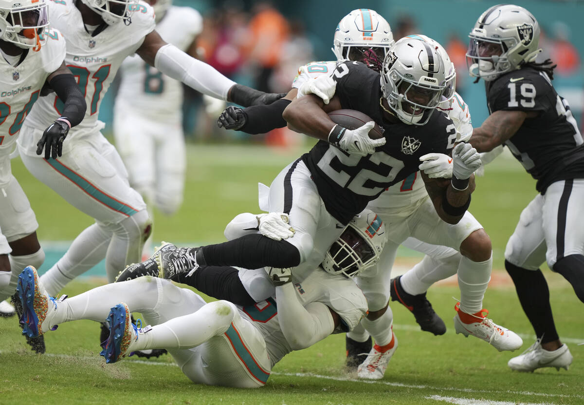 Las Vegas Raiders running back Alexander Mattison (22) runs for a first down during the second ...