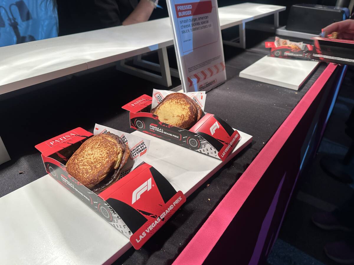 Pressed burgers in little cardboard F1 racecar boxes are shown at T-Mobile Zone at Sphere durin ...