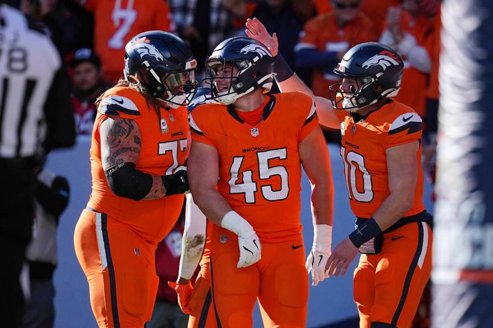 Denver Broncos guard Quinn Meinerz (77), Denver Broncos tight end Nate Adkins (45) and Denver B ...