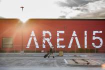 Jessica Fisher walks across the parking lot of Area15, an experiential retail and entertainment ...