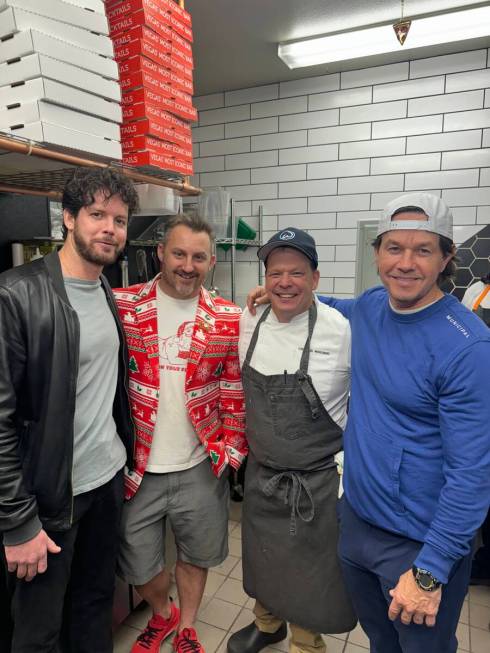 Mark and Paul Wahlberg are shown with restaurant co-owners Nathan Grates, far left and Anthony ...