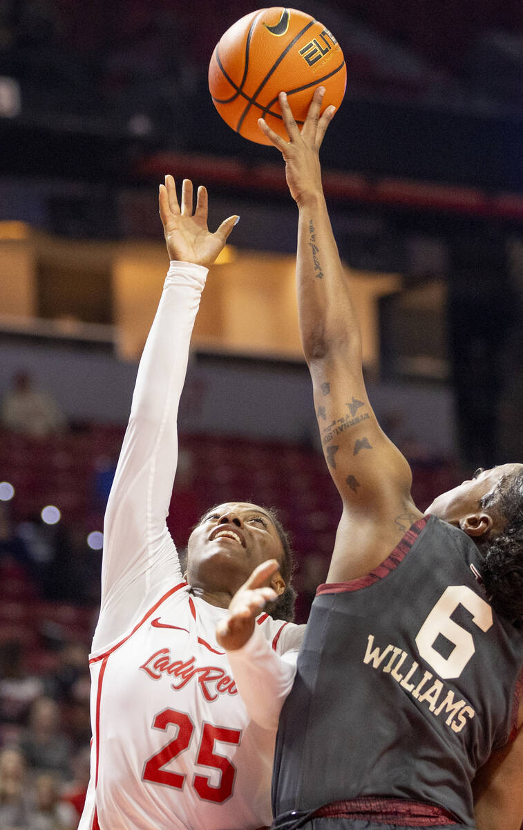 UNLV guard Aaliyah Alexander (25) attempts to shoot the ball over Oklahoma Sooners forward Saha ...