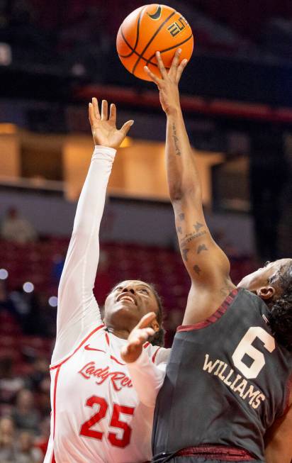 UNLV guard Aaliyah Alexander (25) attempts to shoot the ball over Oklahoma Sooners forward Saha ...