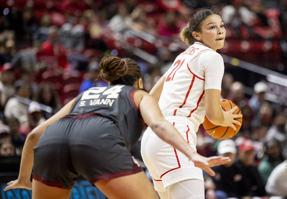 UNLV forward McKinna Brackens (21) looks to pass the ball during the college basketball game ag ...