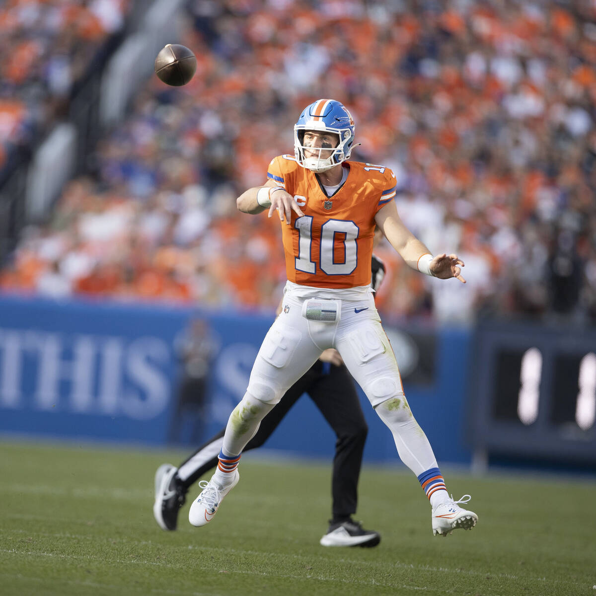 Denver Broncos quarterback Bo Nix (10) throws the football against the Raiders during the secon ...