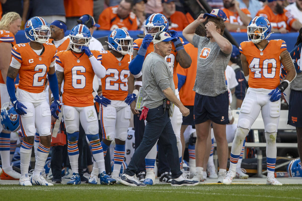 Denver Broncos head coach Sean Payton walks the sideline during the second half of an NFL game ...