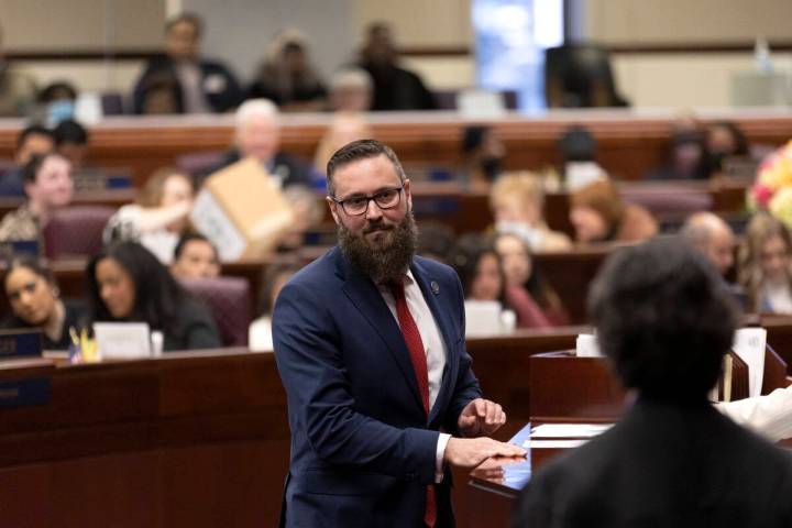 Assemblyman Gregory Hafen II, R-Pahrump, looks to Chief Justice Lidia S. Stiglich after signing ...