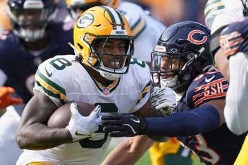 Chicago Bears' T.J. Edwards tries to stop Green Bay Packers' Josh Jacobs during the first half ...