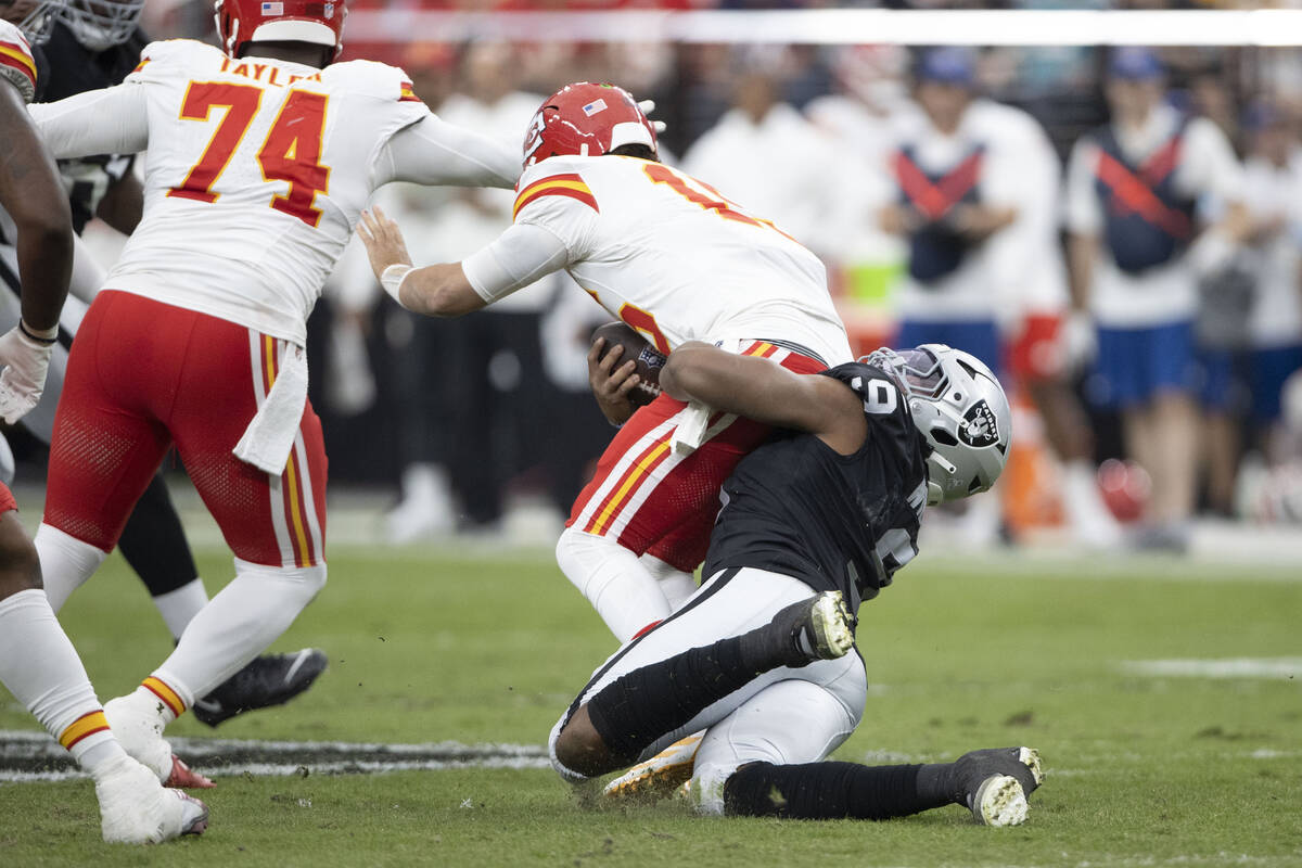 Raiders defensive end Tyree Wilson (9) sacks Kansas City Chiefs quarterback Patrick Mahomes (15 ...