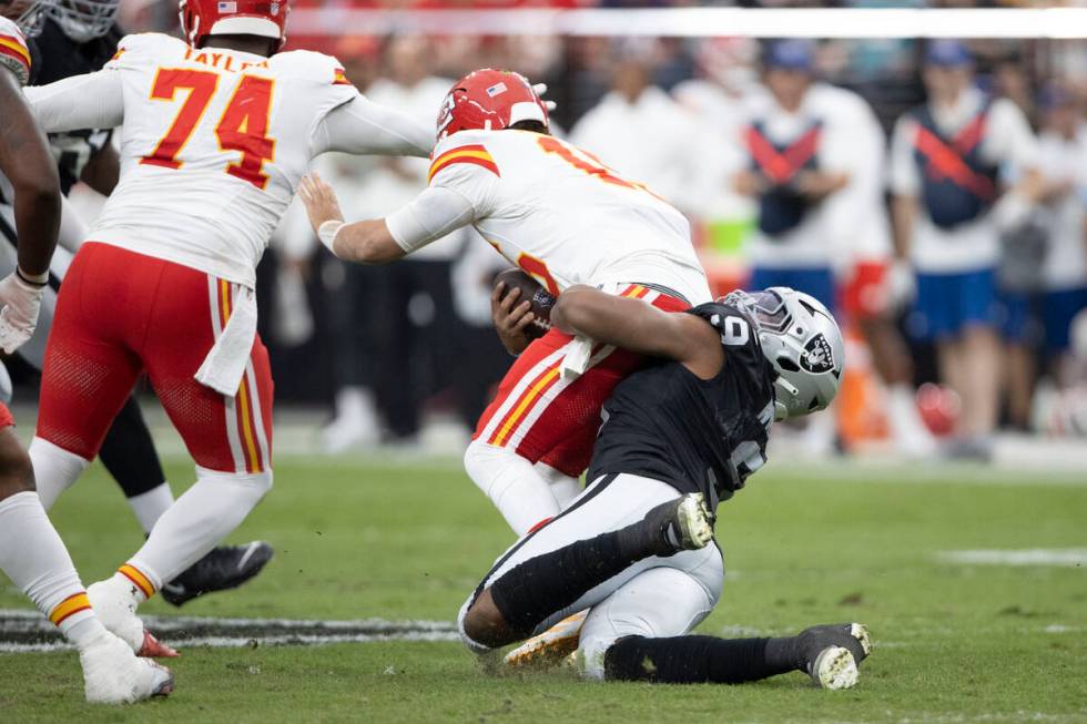 Raiders defensive end Tyree Wilson (9) sacks Kansas City Chiefs quarterback Patrick Mahomes (15 ...