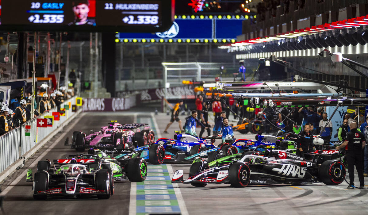 Cars leave the pits during the third practice round for the Formula 1 Las Vegas Grand Prix on F ...