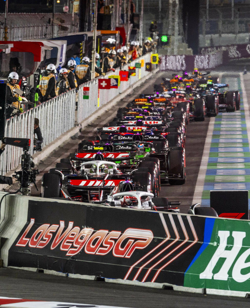 Cars leave the pits during the third practice round for the Formula 1 Las Vegas Grand Prix on F ...