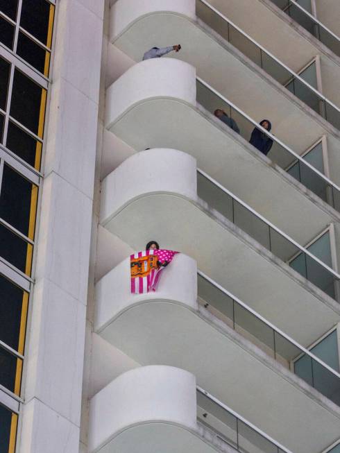 Fans watch from apartments above E. Harmon Avenue during the third practice round for the Formu ...