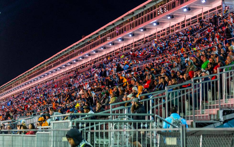 Fans watch the race from the main grandstand during the third practice round for the Formula 1 ...