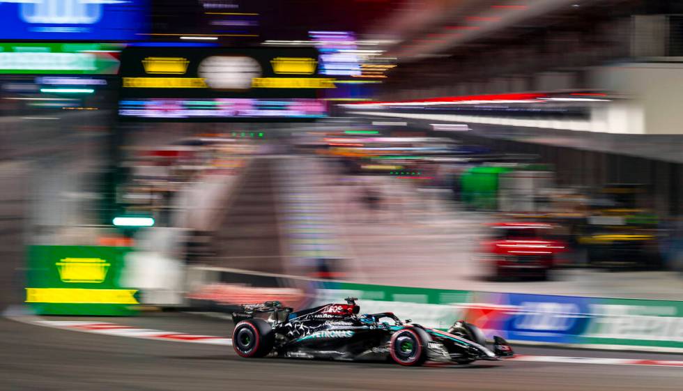 Mercedes driver George Russell navigates around turn one on his way to the pole position during ...