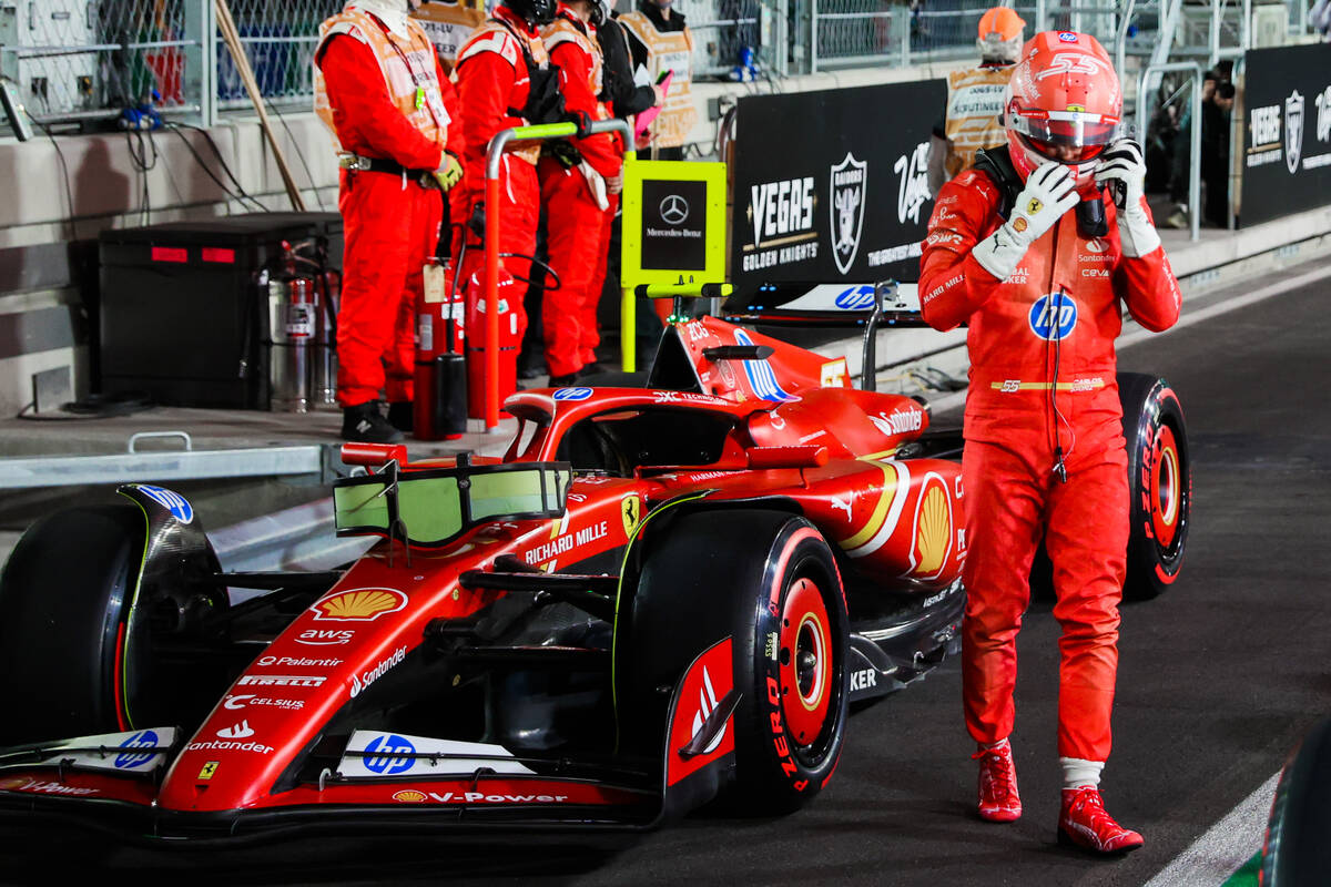 Formula 1 Ferrari driver Carlos Sainz takes his helmet off after coming in second during a qual ...