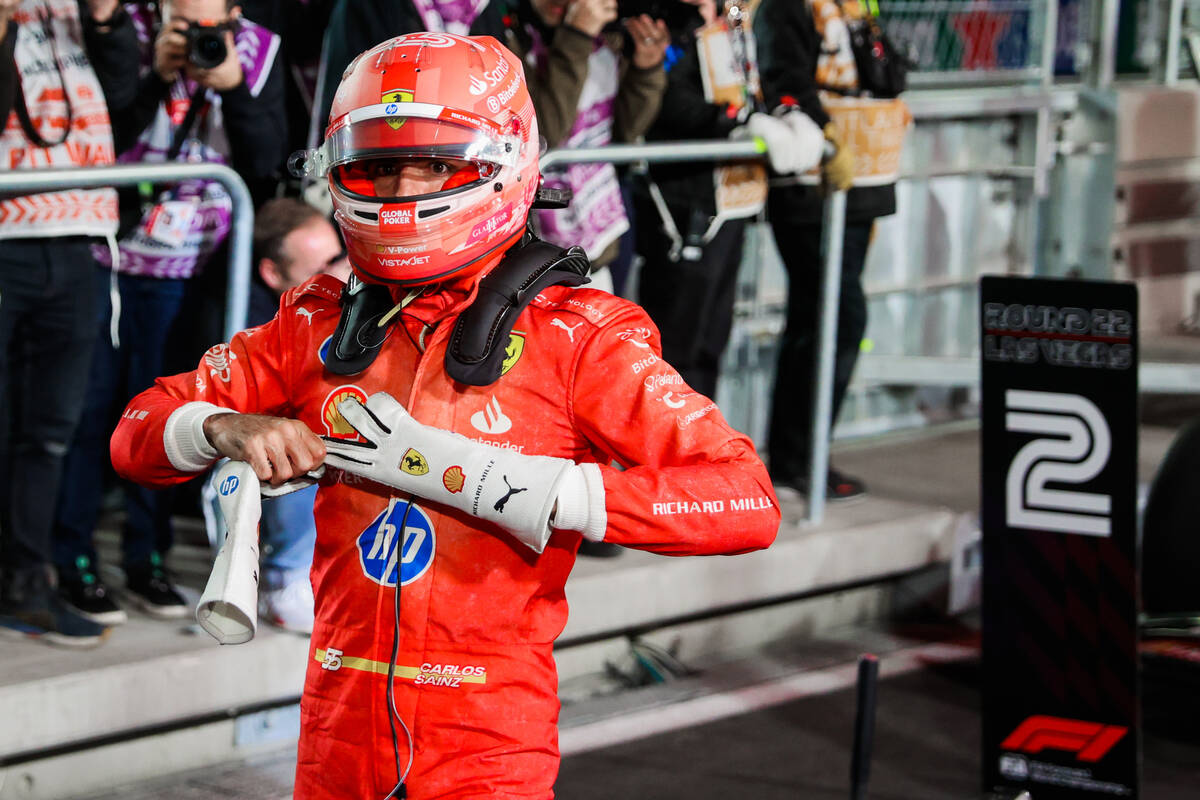 Formula 1 Ferrari driver Carlos Sainz takes his gloves off after coming in second during a qual ...