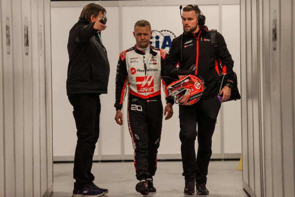 Formula 1 Haas driver Kevin Magnussen walks back from the track after being eliminated during a ...