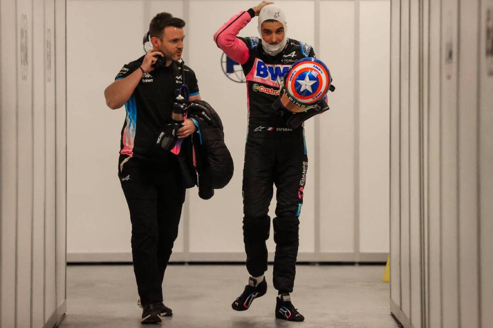 Formula 1 Alpine driver Esteban Ocon walks back after being eliminated during a qualifying race ...