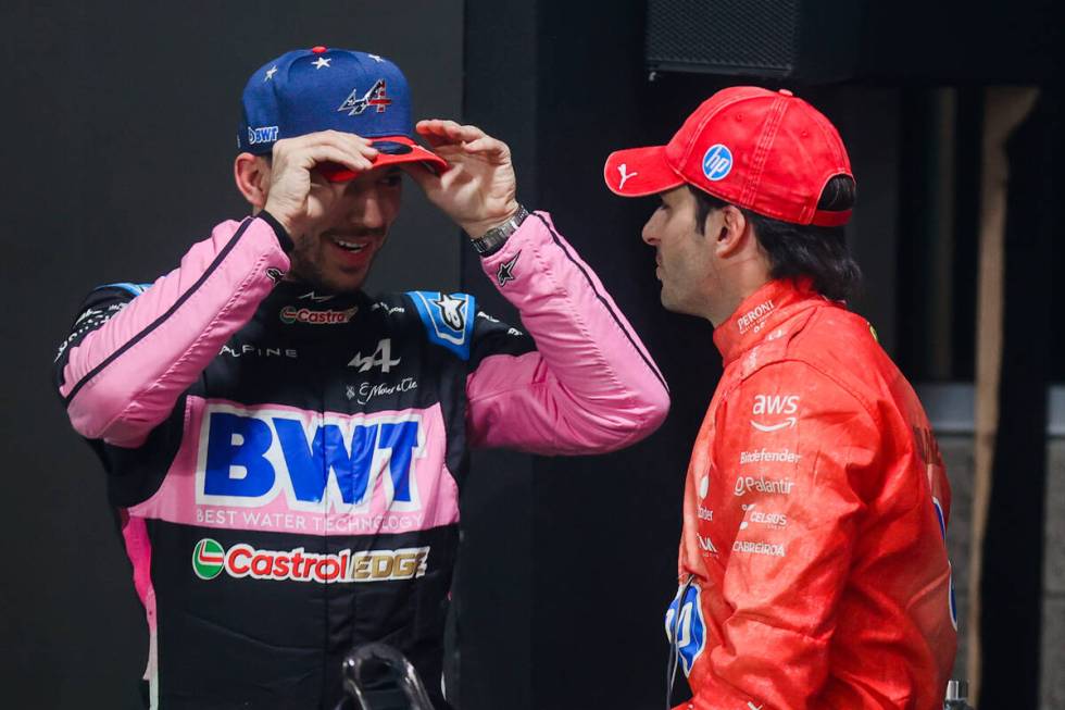 Formula 1 drivers Pierre Gasly, left, and Carlos Sainz speak after coming in top three during a ...