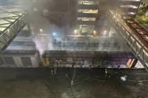 Firefighters battle a blaze inside a railcar in downtown Las Vegas on Friday, Nov. 22, 2024. (S ...