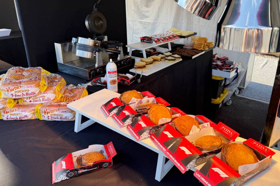 Pressed burgers in cardboard F1 racecar boxes are shown at T-Mobile Zone at Sphere during F1 La ...