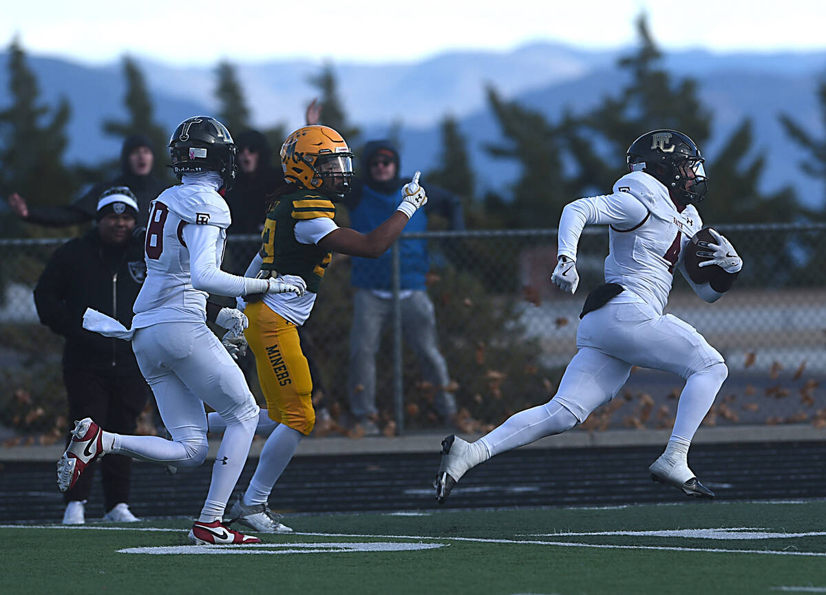 Faith Lutheran’s Rouselle Shepard runs for yardage against Bishop Manogue during the Class 5A ...