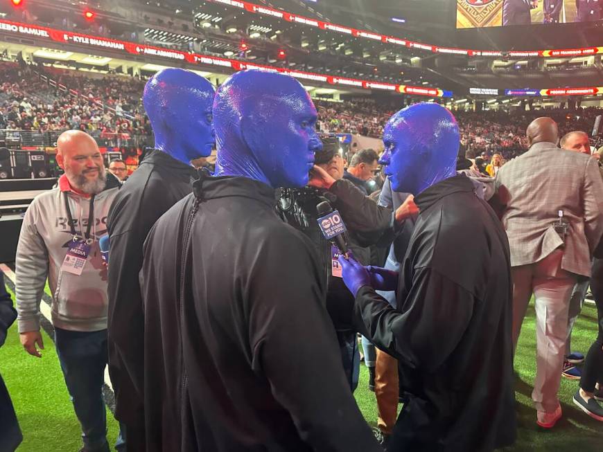 Members of the Blue Man Group are shown being interviewed during the Super Bowl Opening Night c ...