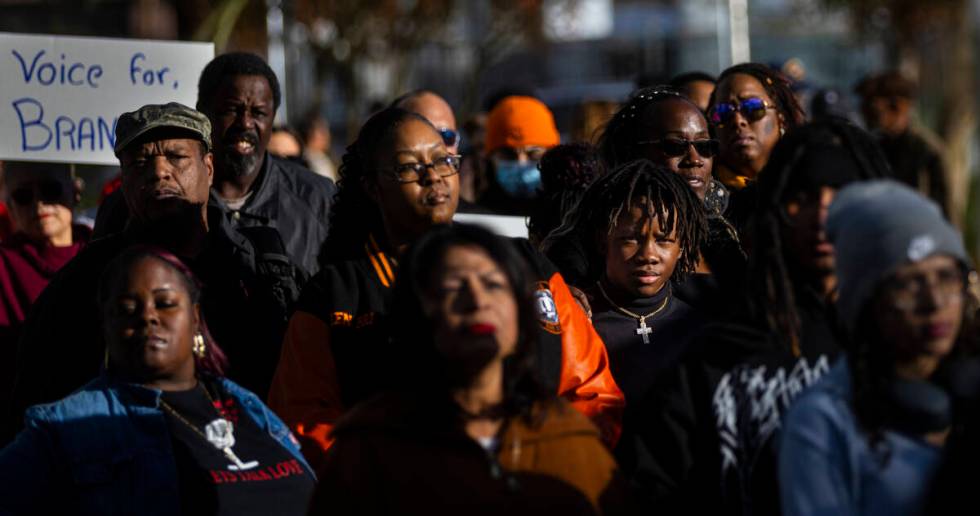 People participate in a rally for Brandon Durham, who was shot and killed by police in his own ...