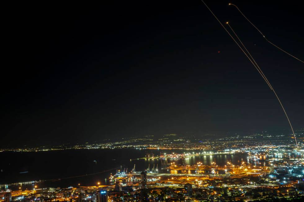 Israeli Iron Dome air defense system fires to intercept rockets that were launched from Lebanon ...