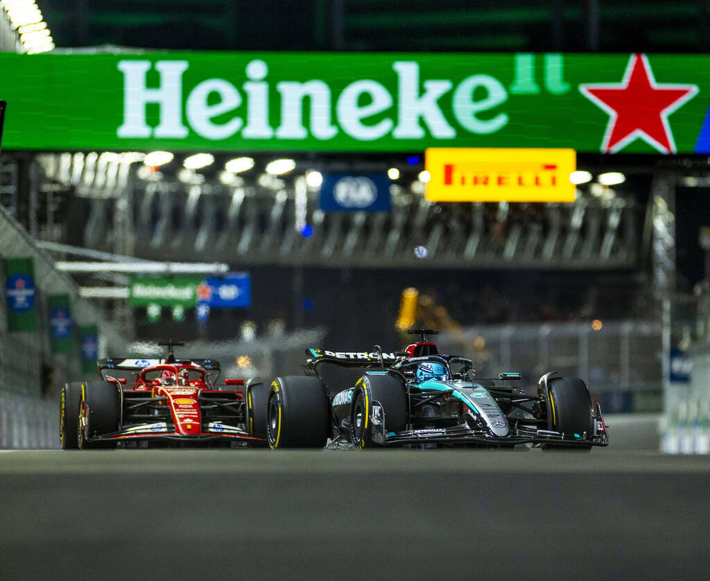 Mercedes driver George Russell leads Ferrari driver Carlos Sainz through turn one during the Fo ...