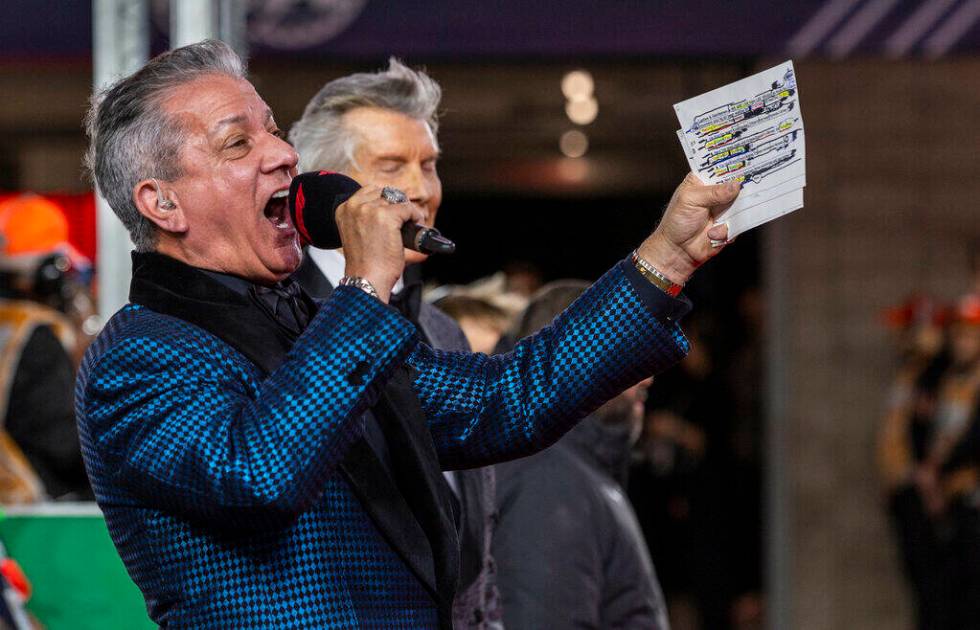 Bruce Buffer and his brother Michael take turns introducing the drivers on the track during the ...