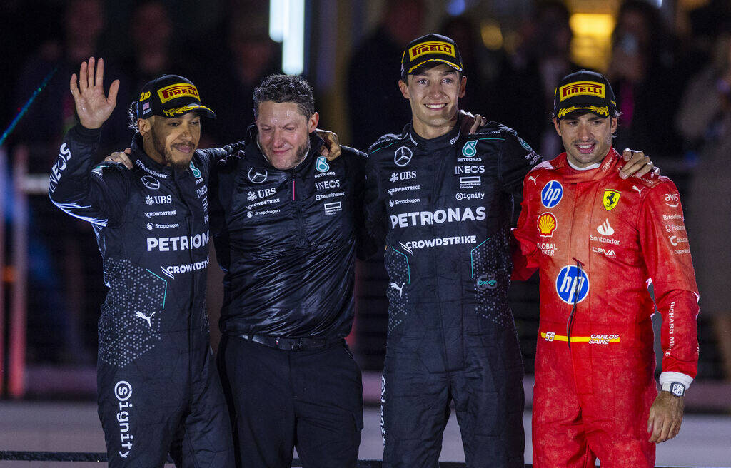 Mercedes driver Lewis Hamilton, a teammate and George Russell with Ferrari driver Carlos Sainz ...