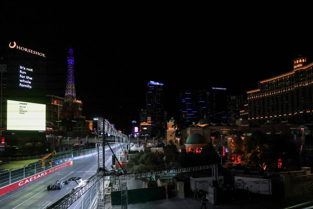 A race car driver navigates the circuit during the Formula 1 Las Vegas Grand Prix on the Strip ...