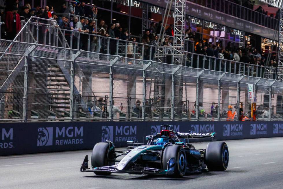 Formula 1 Mercedes driver George Russell zooms by during the Formula 1 Las Vegas Grand Prix on ...