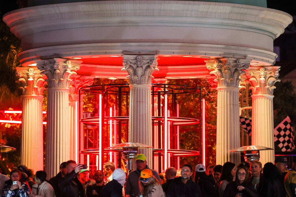 Formula 1 fans catch sights of the race from Caesars Palace during the Formula 1 Las Vegas Gran ...