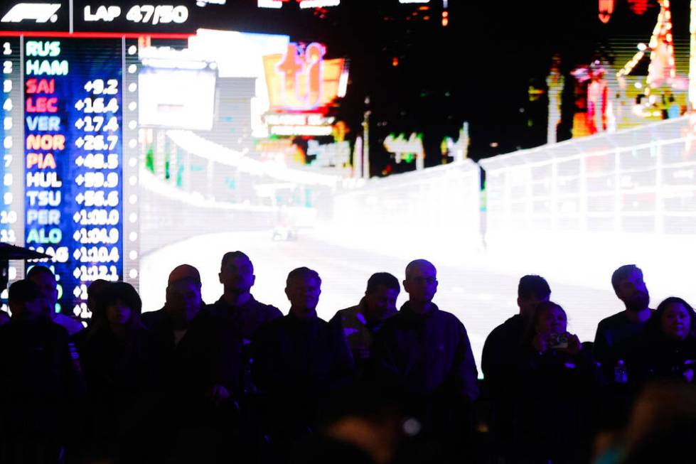 Formula 1 fans catch sights of the race from Caesars Palace during the Formula 1 Las Vegas Gran ...