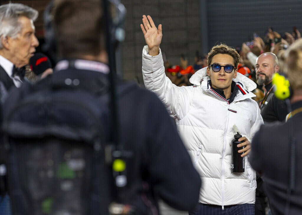 Mercedes driver George Russell waves to the fans as he's introduced before the start during the ...