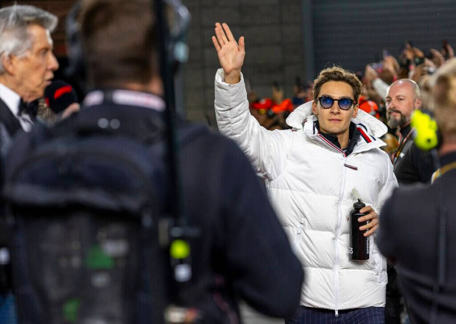 Mercedes driver George Russell waves to the fans as he's introduced before the start during the ...