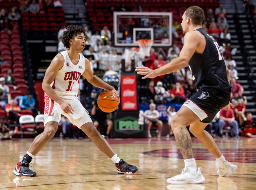 UNLV guard Dedan Thomas Jr. (11) looks to make a play during the college basketball game agains ...