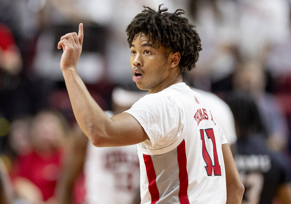 UNLV guard Dedan Thomas Jr. (11) looks for a play call during the college basketball game again ...