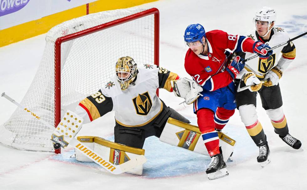 Vegas Golden Knights goaltender Adin Hill (33) makes a save as Montreal Canadiens' Lucas Condot ...